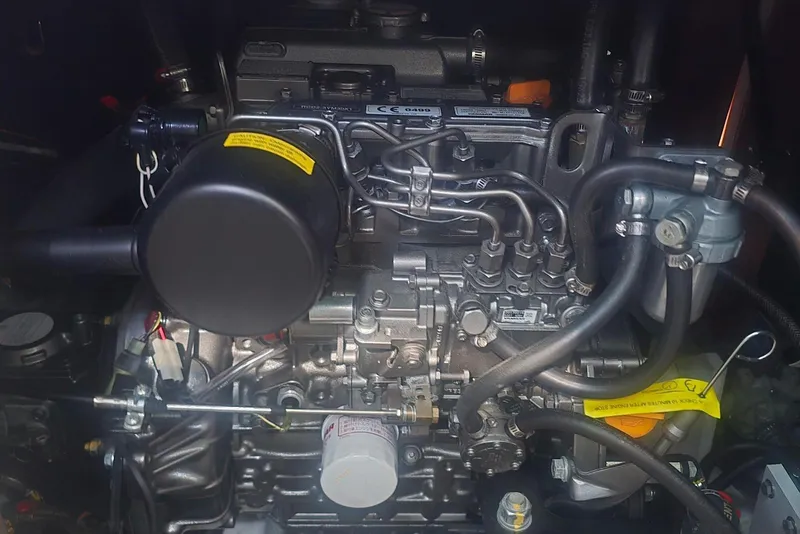 Slide: The Image of Engine of a 2018 Beneteau Oceanis 38.1 sailboat, showcasing intricate mechanical components. - 37