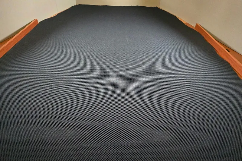 Slide: The Image of Interior cabin flooring of a 2018 Beneteau Oceanis 38.1 sailboat, featuring textured surface. - 39