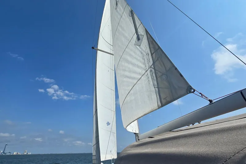 Slide: The Image of Sailing on a 2018 Beneteau Oceanis 38.1 under clear blue skies. - 9