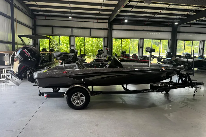 The Image of 2020 Ranger Z185 boat in showroom, featuring sleek design and powerful engine. - 0