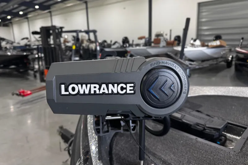 Slide: The Image of Lowrance device on 2020 Ranger Z185 boat in showroom setting. - 11