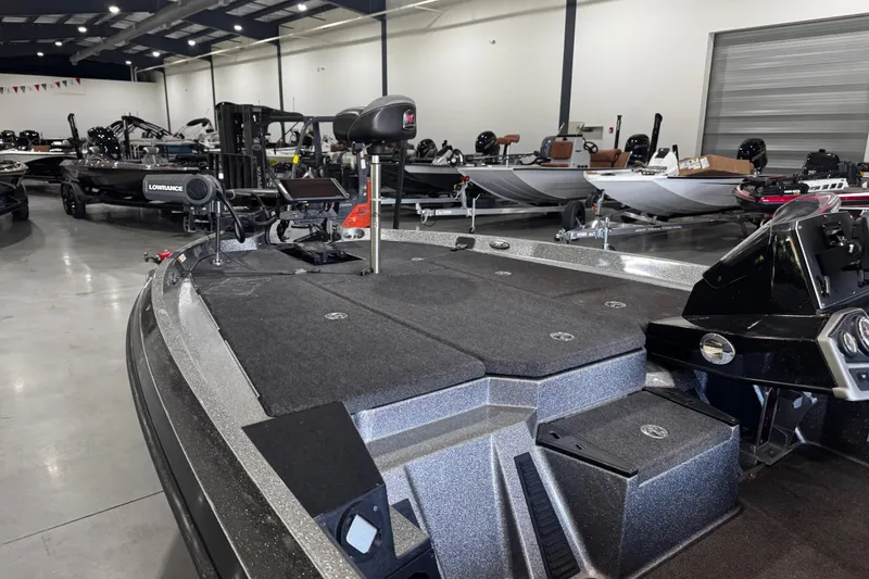 Slide: The Image of 2020 Ranger Z185 boat in showroom, featuring advanced navigation equipment and spacious deck. - 12