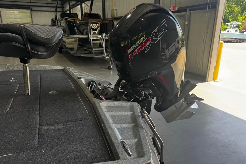 Slide: The Image of 2020 Ranger Z185 boat with Mercury Pro XS 150 engine in a garage setting. - 15