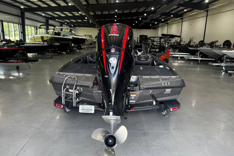 Slide: The Image of 2020 Ranger Z185 boat in showroom, rear view with powerful outboard motor. - 16