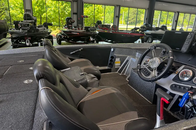 Slide: The Image of Interior of a 2020 Ranger Z185 boat with steering wheel and dashboard controls. - 2