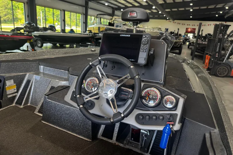 Slide: The Image of 2020 Ranger Z185 boat dashboard with steering wheel and navigation system in showroom. - 3