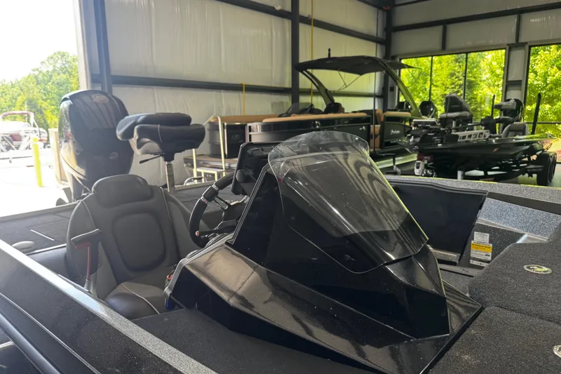 Slide: The Image of 2020 Ranger Z185 boat interior in a showroom with other boats. - 4