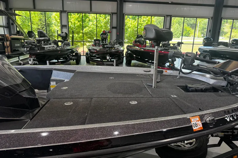 Slide: The Image of 2020 Ranger Z185 boat displayed in a showroom with other boats in the background. - 5