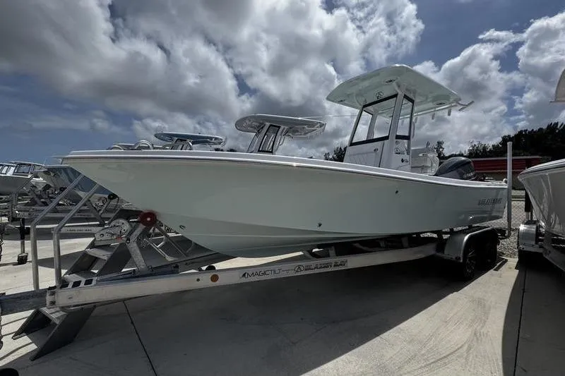 The Image of 2026 Blazer Bay 2440 boat on trailer under cloudy sky. - 1