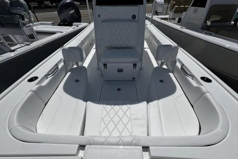 Slide: The Image of 2026 Blazer Bay 2440 boat interior with white cushioned seating and modern design. - 13