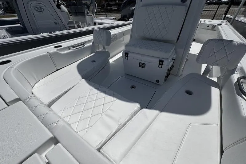 Slide: The Image of 2026 Blazer Bay 2440 boat interior with white cushioned seating and modern design. - 15