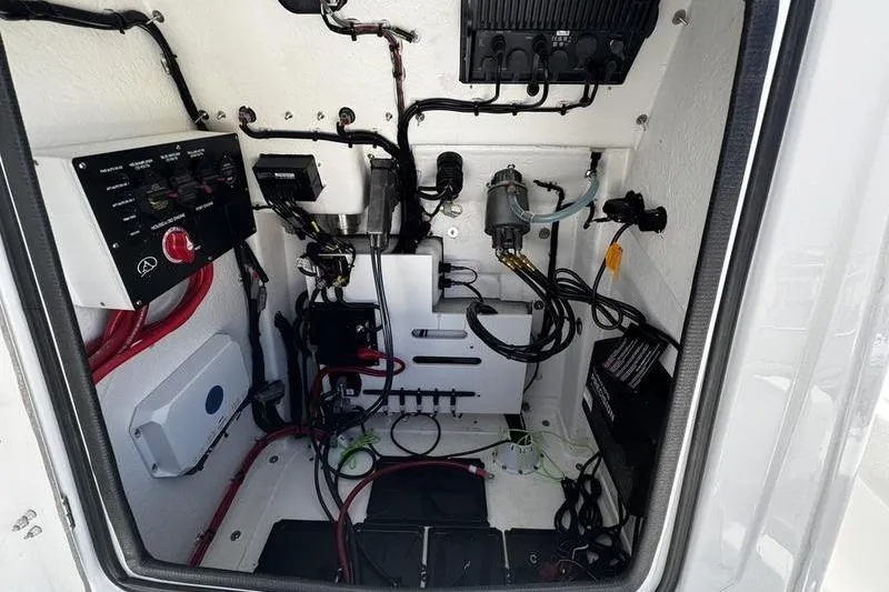 Slide: The Image of Electrical compartment of 2026 Blazer Bay 2440 boat with wiring and components. - 16