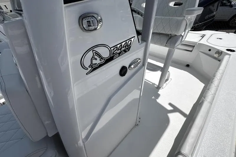 Slide: The Image of 2026 Blazer Bay 2440 boat interior with logo and seating detail. - 19