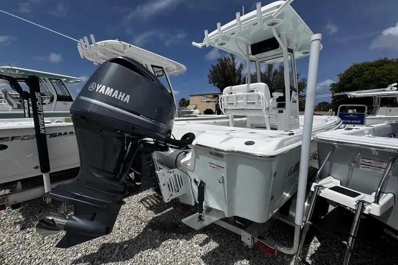 Slide: The Image of 2026 Blazer Bay 2440 boat with Yamaha outboard motor, displayed outdoors. - 3