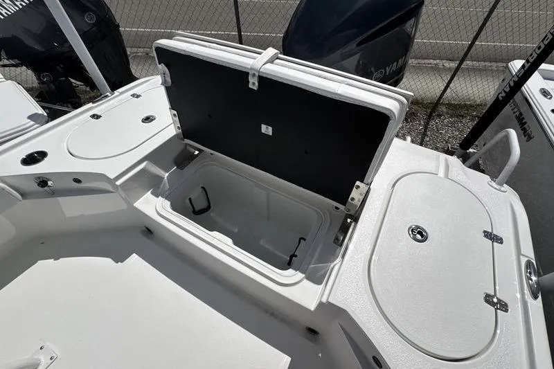 Slide: The Image of 2026 Blazer Bay 2440 boat storage compartment open, showcasing spacious interior design. - 31