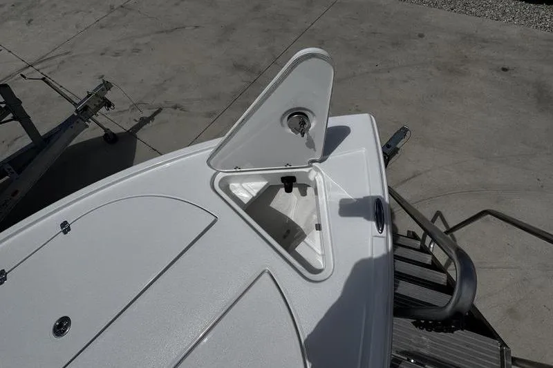 Slide: The Image of 2026 Blazer Bay 2440 boat deck with open storage compartment. - 7