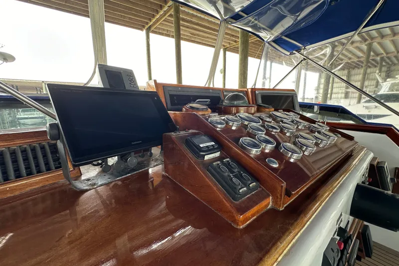 Slide: The Image of 1980 Bertram 58 Convertible helm with gauges and navigation equipment. - 25
