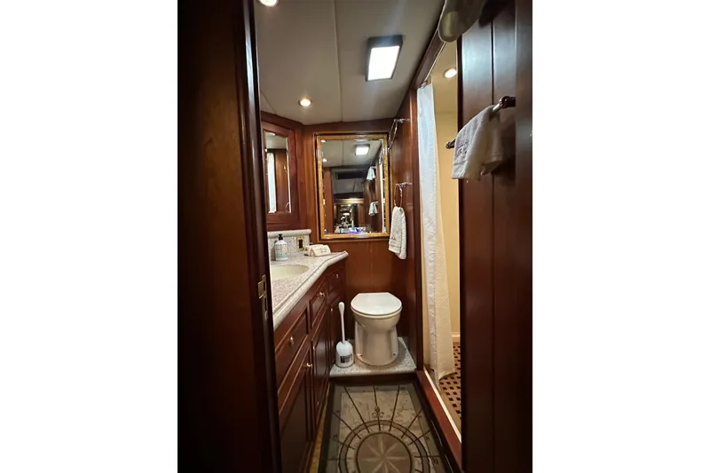 Slide: The Image of Luxurious bathroom interior of 1980 Bertram 58 Convertible yacht with wood cabinetry. - 71