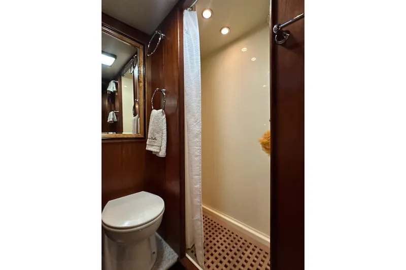 Slide: The Image of Bathroom interior of 1980 Bertram 58 Convertible yacht with shower and toilet. - 75