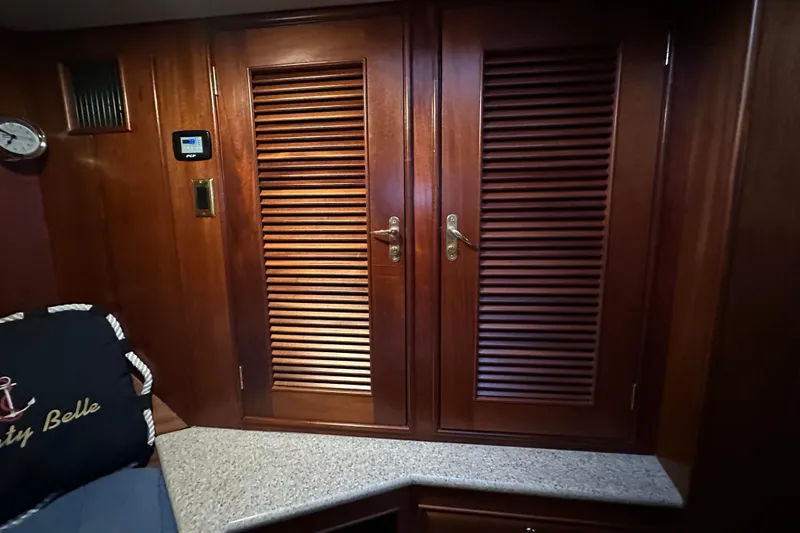 Slide: The Image of Interior of 1980 Bertram 58 Convertible with wooden cabinets and granite countertop. - 82