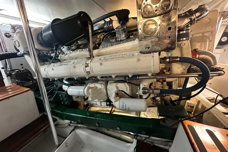 Slide: The Image of Engine room of a 1980 Bertram 58 Convertible yacht, showcasing detailed machinery. - 89