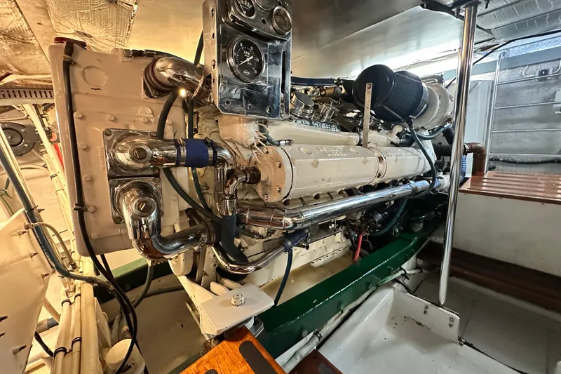 Slide: The Image of Engine room of a 1980 Bertram 58 Convertible yacht, showcasing detailed machinery. - 91