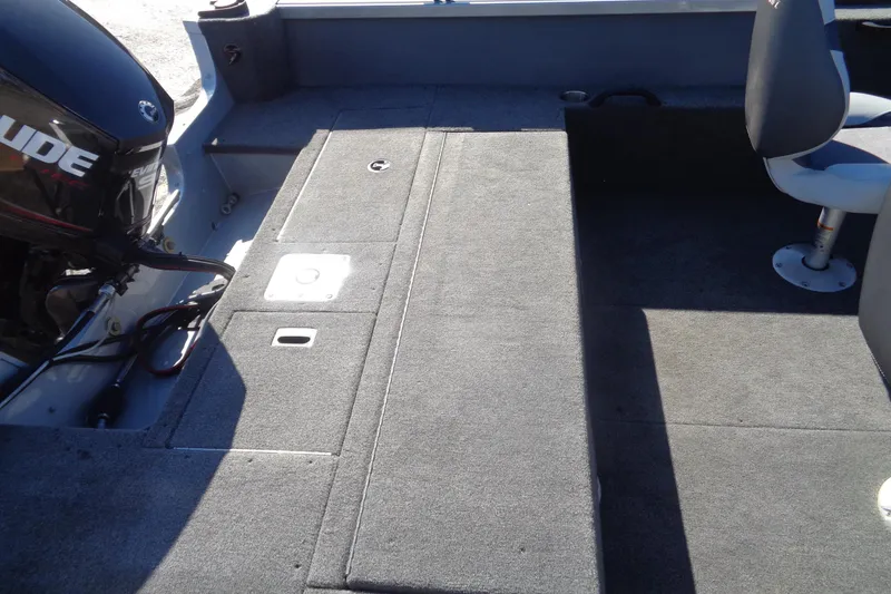 Slide: The Image of 2015 Alumacraft Competitor 165 CS boat interior with Evinrude motor and seating. - 13