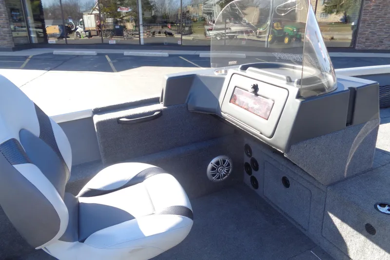 Slide: The Image of 2015 Alumacraft Competitor 165 CS boat interior with seating and dashboard view. - 14