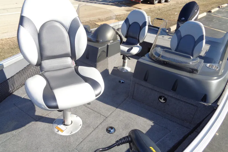 Slide: The Image of 2015 Alumacraft Competitor 165 CS boat interior with swivel seats and console. - 16