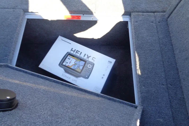Slide: The Image of Box of Humminbird Helix 5 sonar GPS in Alumacraft Competitor 165 CS boat storage. - 21