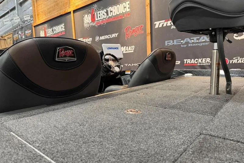 Slide: The Image of 2021 Ranger Z520L boat interior with branded seats and fishing equipment. - 12