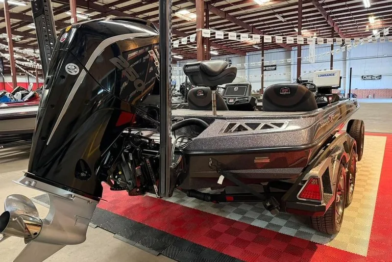 Slide: The Image of 2021 Ranger Z520L bass boat with powerful outboard motor in showroom setting. - 13