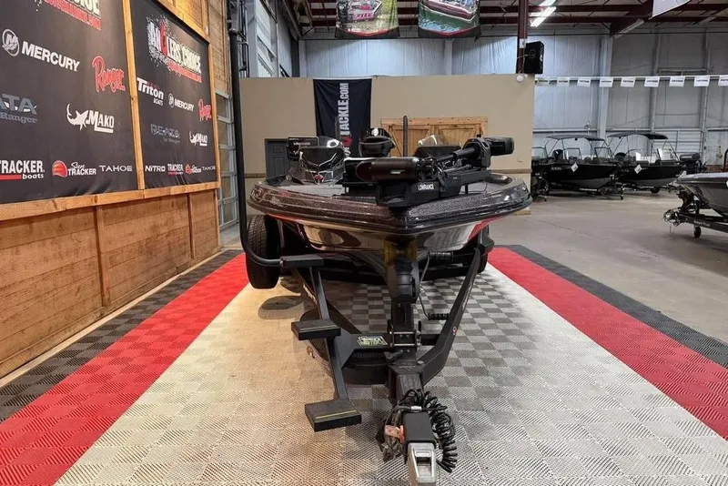 Slide: The Image of 2021 Ranger Z520L boat displayed indoors on a trailer. - 16