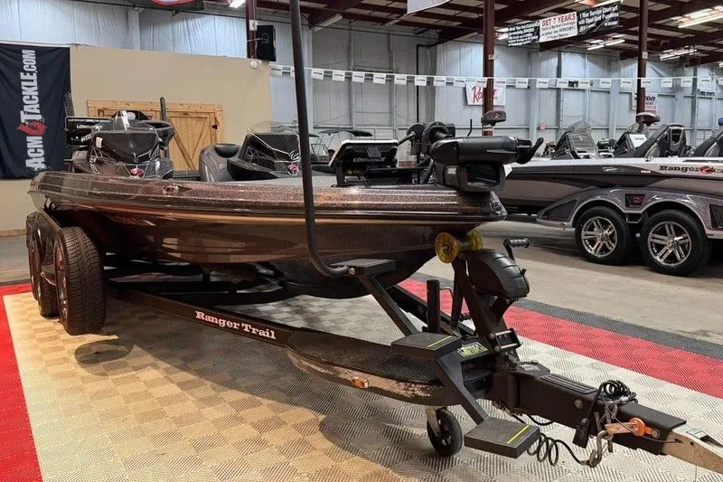 Slide: The Image of 2021 Ranger Z520L bass boat on trailer in showroom setting. - 2