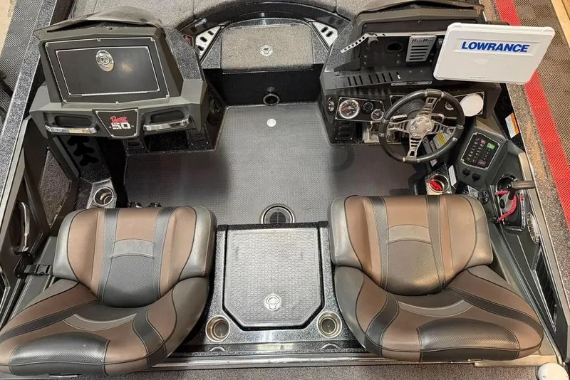 Slide: The Image of 2021 Ranger Z520L boat interior with dual seats, steering wheel, and control panel. - 3