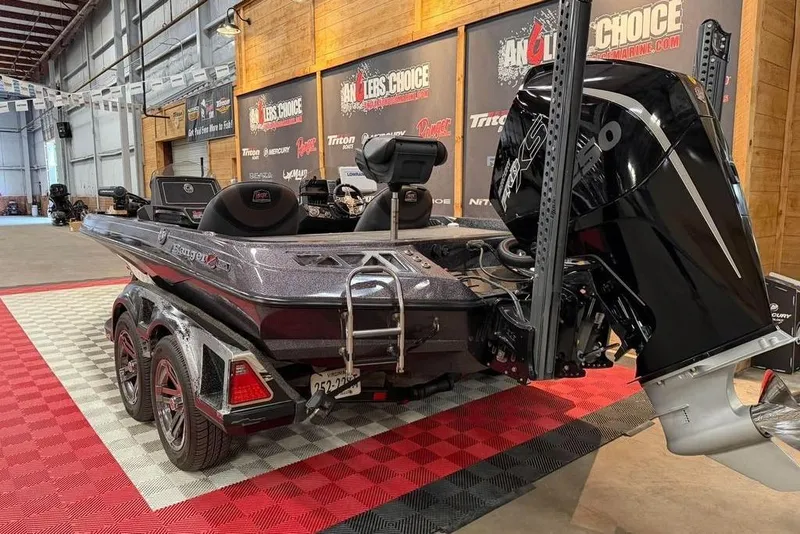 Slide: The Image of 2021 Ranger Z520L boat in showroom with powerful outboard motor. - 5
