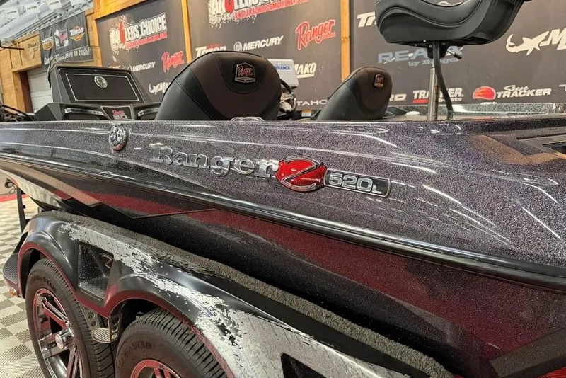 Slide: The Image of 2021 Ranger Z520L boat with sleek design and detailed branding in showroom setting. - 7