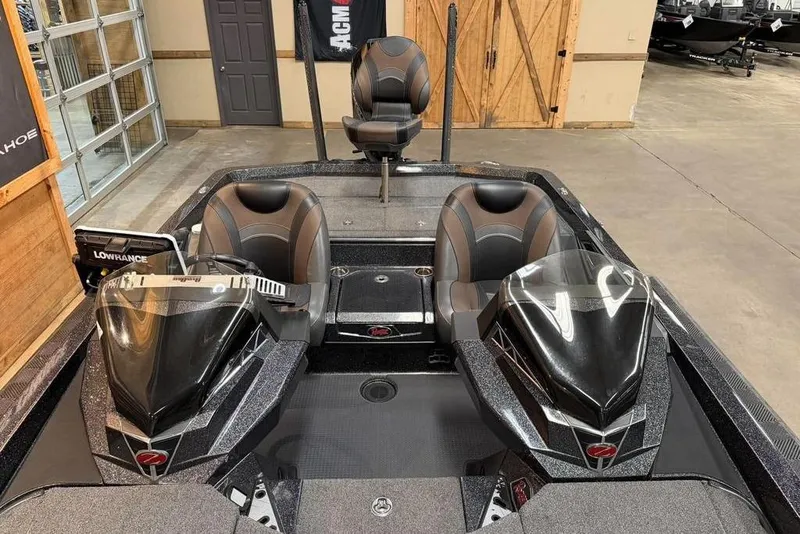 Slide: The Image of 2021 Ranger Z520L boat interior with dual seats and Lowrance electronics. - 8