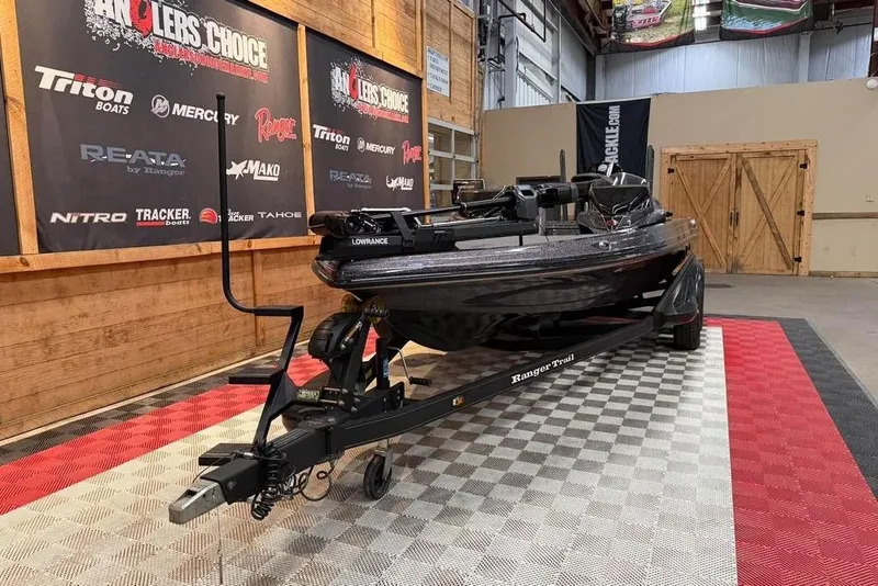 Slide: The Image of 2021 Ranger Z520L boat on trailer in showroom with branded banners. - 9