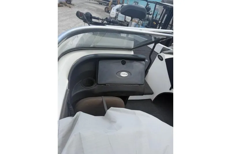 Slide: The Image of 2008 Champion 214 SX boat interior with dashboard and seating area. - 8