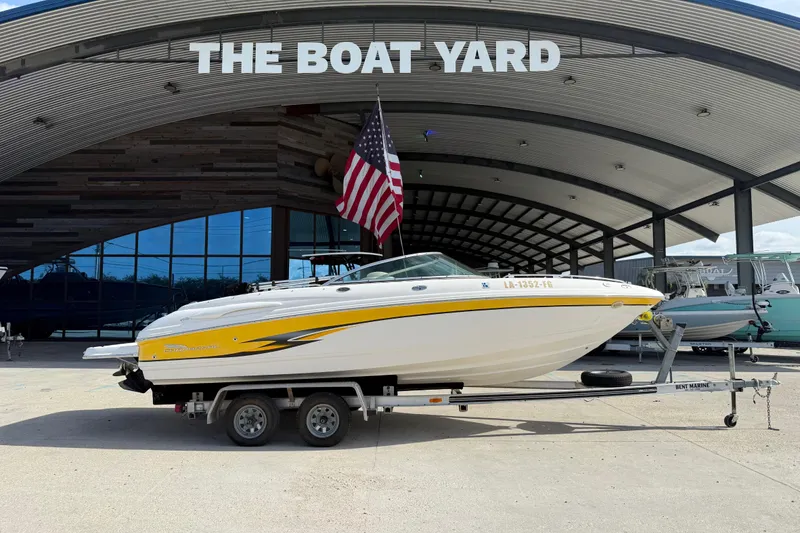 Slide: The Image of 2002 Chaparral 220 SSi boat on trailer at The Boat Yard, American flag displayed. - 3