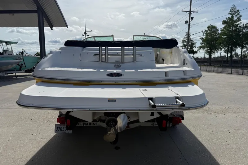 Slide: The Image of Rear view of a 2002 Chaparral 220 SSi boat on a trailer in a marina. - 5