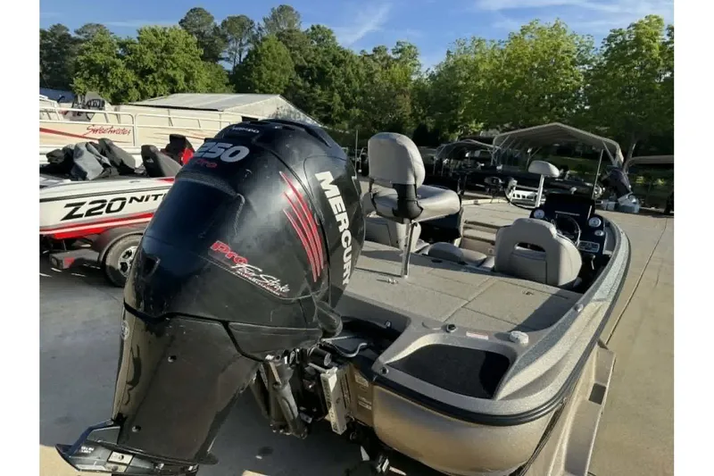 Slide: The Image of 2018 Nitro Z21 Pro boat with Mercury 250 Pro XS engine, parked outdoors. - 12