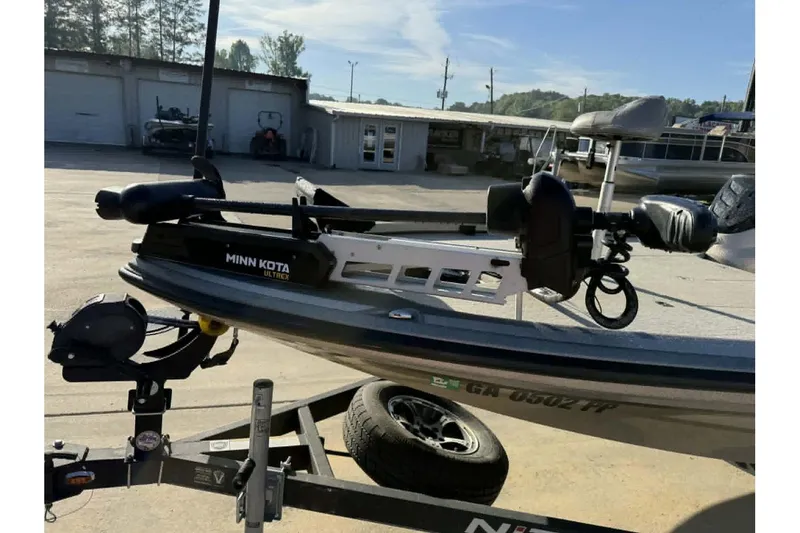 Slide: The Image of 2018 Nitro Z21 Pro boat with Minn Kota Ultrex trolling motor in a marina setting. - 14