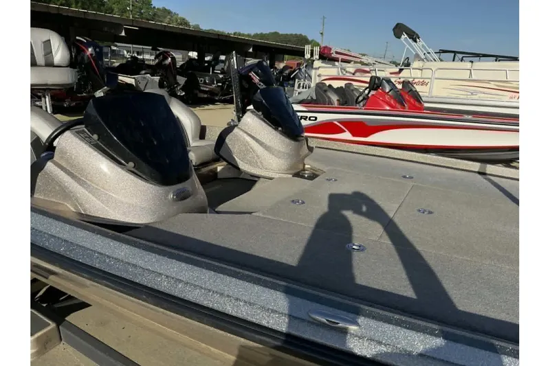 Slide: The Image of 2018 Nitro Z21 Pro fishing boat with dual consoles in a marina setting. - 9
