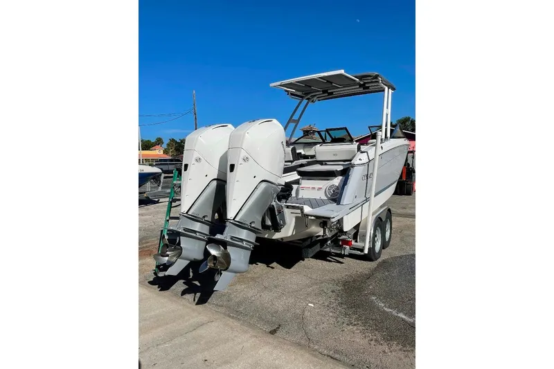 Slide: The Image of 2022 Cobalt R8 Outboard boat with dual engines on a trailer. - 6