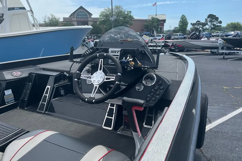 Slide: The Image of 2017 Ranger Z518 Cup-Equipped boat interior with steering wheel and dashboard controls. - 7