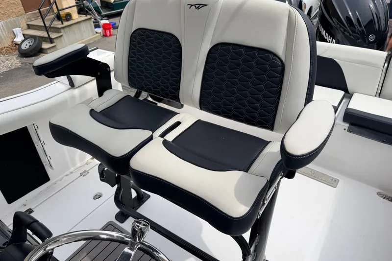Slide: The Image of 2024 Tidewater 256 LXF boat seats with black and white upholstery, showcasing modern design. - 17