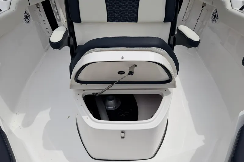 Slide: The Image of 2024 Tidewater 256 LXF boat seat with open storage compartment. - 21