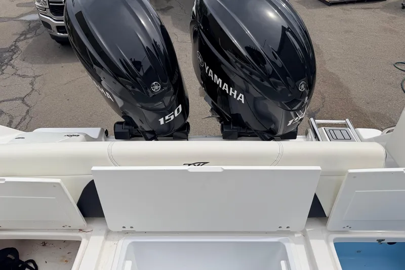 Slide: The Image of 2024 Tidewater 256 LXF boat with dual Yamaha 150 outboard engines. - 29